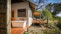 Outdoor bath and deck of the luxury tent at Amber River Camp