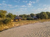 Named after the honeyguide bird, Time + Tide Nsolo plays a host to some of the most striking and unusual bird species in South Luangwa National Park. It's five charming rooms stretch out on raised wooden platforms along a bend in the seasonal Luwi River. Each has a feather-top bed, open air en-suite bathroom and a shady private deck offering views of a permanent river lagoon that teems with wildli