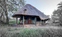 The thatch roofs over large walk-in Meru style tents ensure that they remain cool in the heat of summer