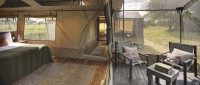 Olakira Migration Camp - Family room with corridor to additional bedroom and deck area