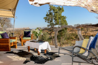 We have four luxury safari tents with an elevated view over the waterhole.
