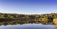 Kichaka Lodge overlooks a waterhole that is frequently visited by hippos and other wildlife.