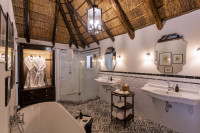 The bathrooms are an indulgence, with enormous baths, rain shower heads and “his & hers” basins.