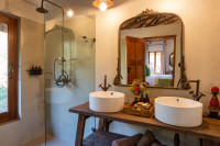 Each chalet has an en-suite bathroom with a shower and "His & Hers" basins.