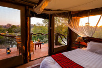 Each safari tent has an en-suite bathroom and veranda presenting a unique view from the tree canopy.