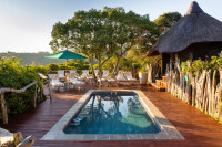 Guests can sunbathe around the swimming pool or relax in the shaded gazebo.