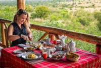 Our client enjoying breakfast at Zebra Safari Lodge-Kidepo