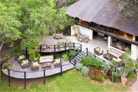 Sun deck, dining deck and main lounge at Waterberry overlooking the Zambezi