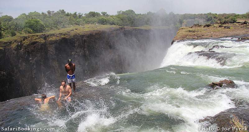 Tourists in Devil's Pool, Victoria Falls