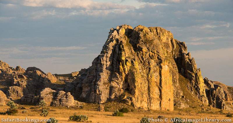 Sandstone formations jutting out from grassland at Isalo National Park, Madagascar