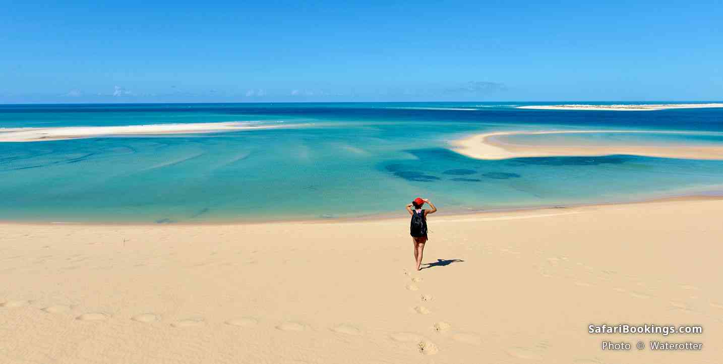 Tourist walking on an isolated beach