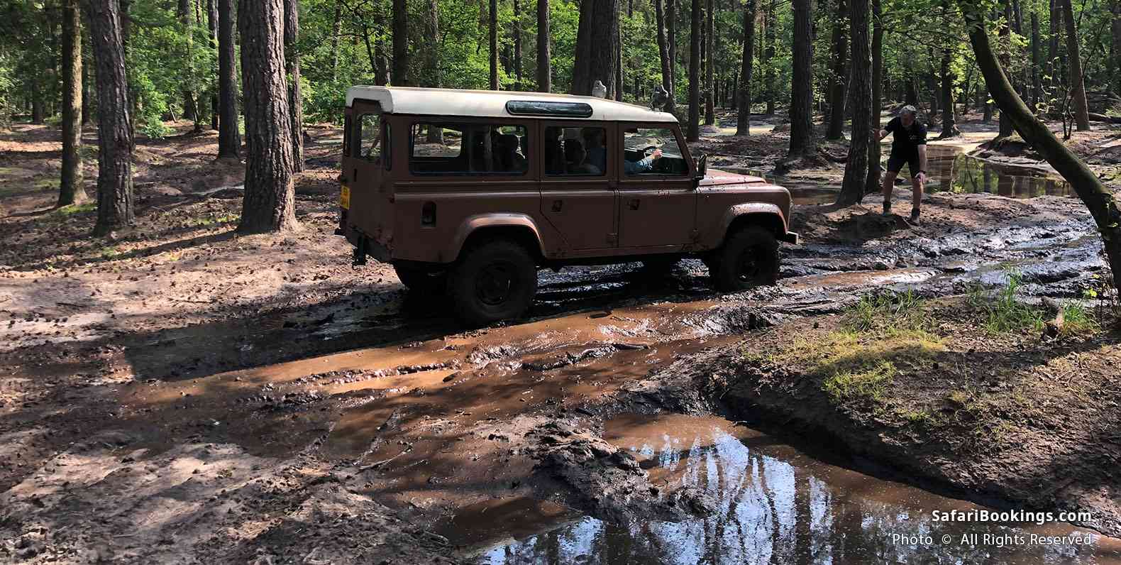 Driving through muddy water during 4WD driving course