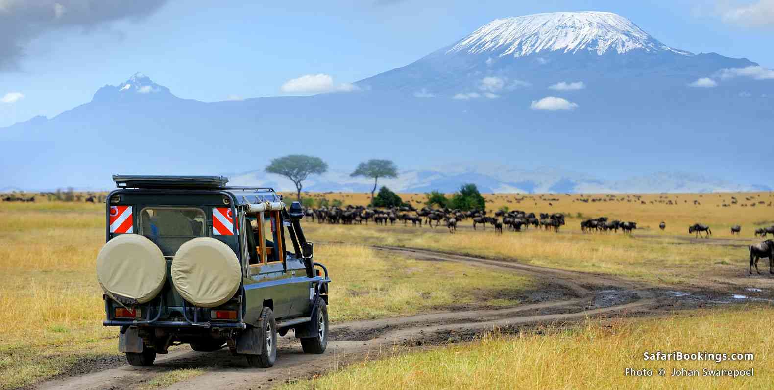 Tourist vehicle in front of Mount Kilimanjaro
