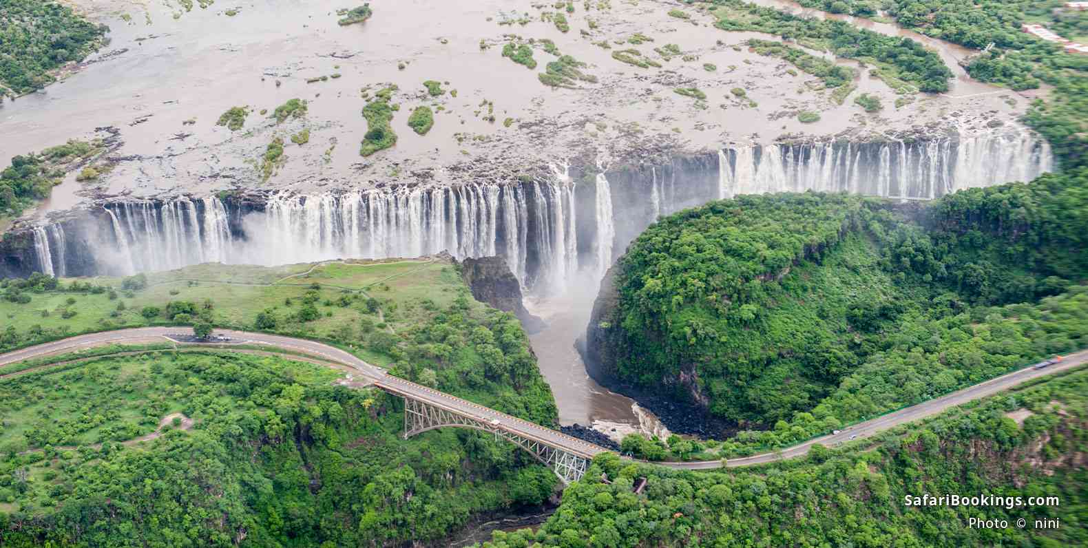 Aerial view of Victoria Falls and the Victoria Falls Bridge, which connects Zambia and Zimbabwe