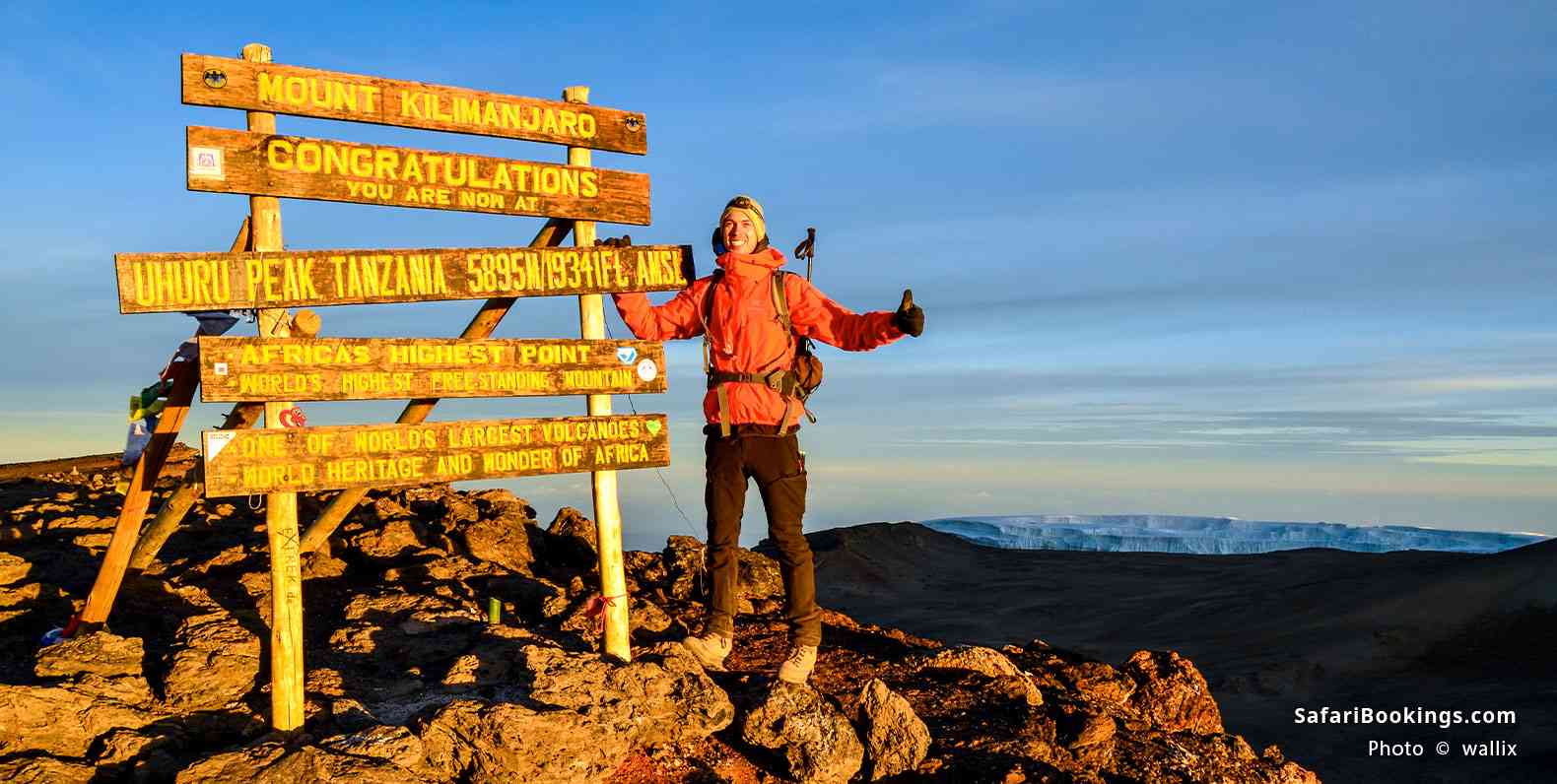 Hiker at the summit of Mt Kilimanjaro