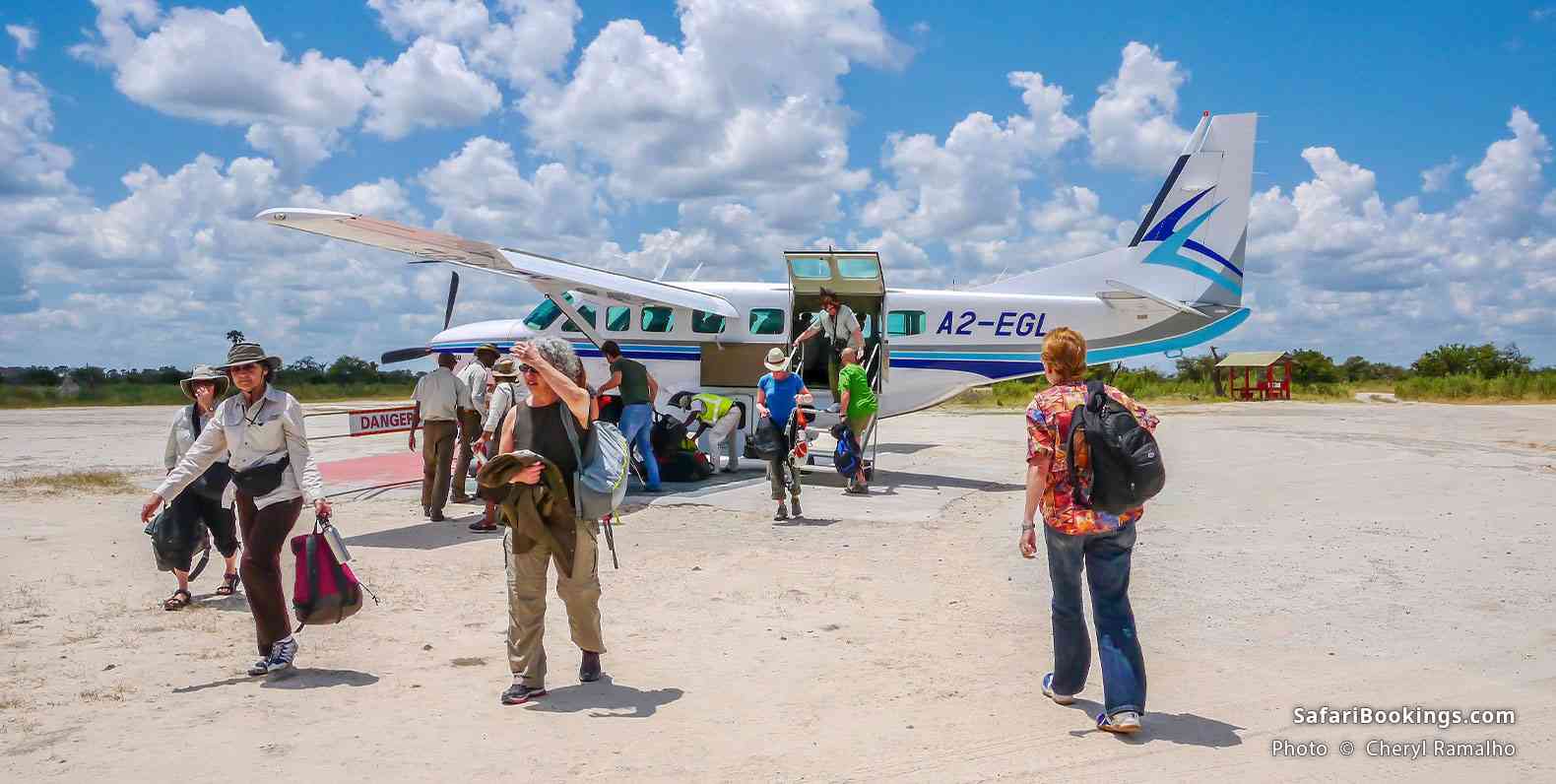 Guests arriving in the Okavango Delta by small aircraft, Botswana