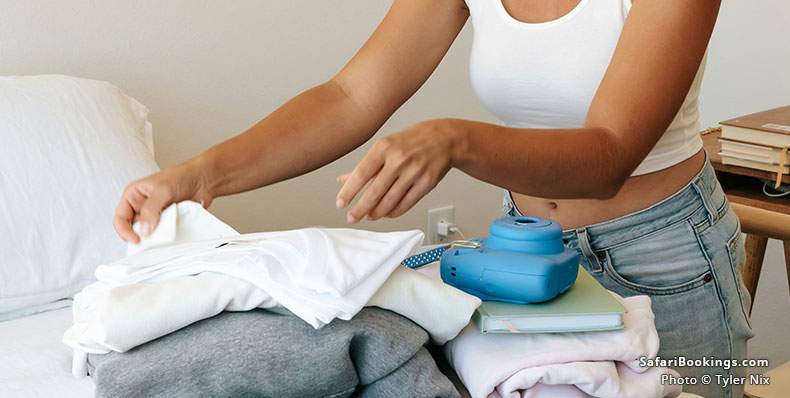 Woman packing a suitcase