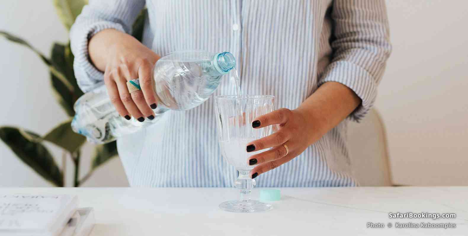 Woman pouring water into a glass