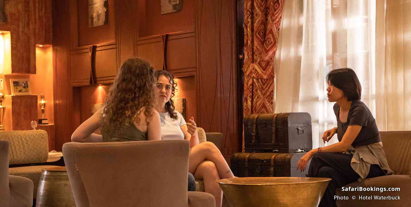 Guests relaxing in the lounge area of Hotel Waterbuck