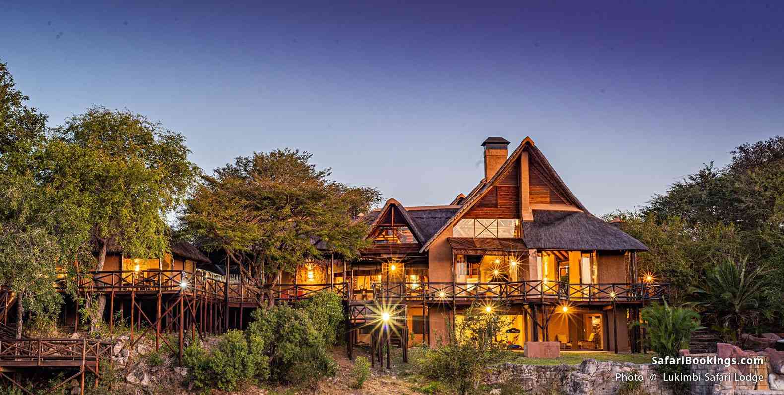 Lukimbi Safari Lodge illuminated by the lights at dusk