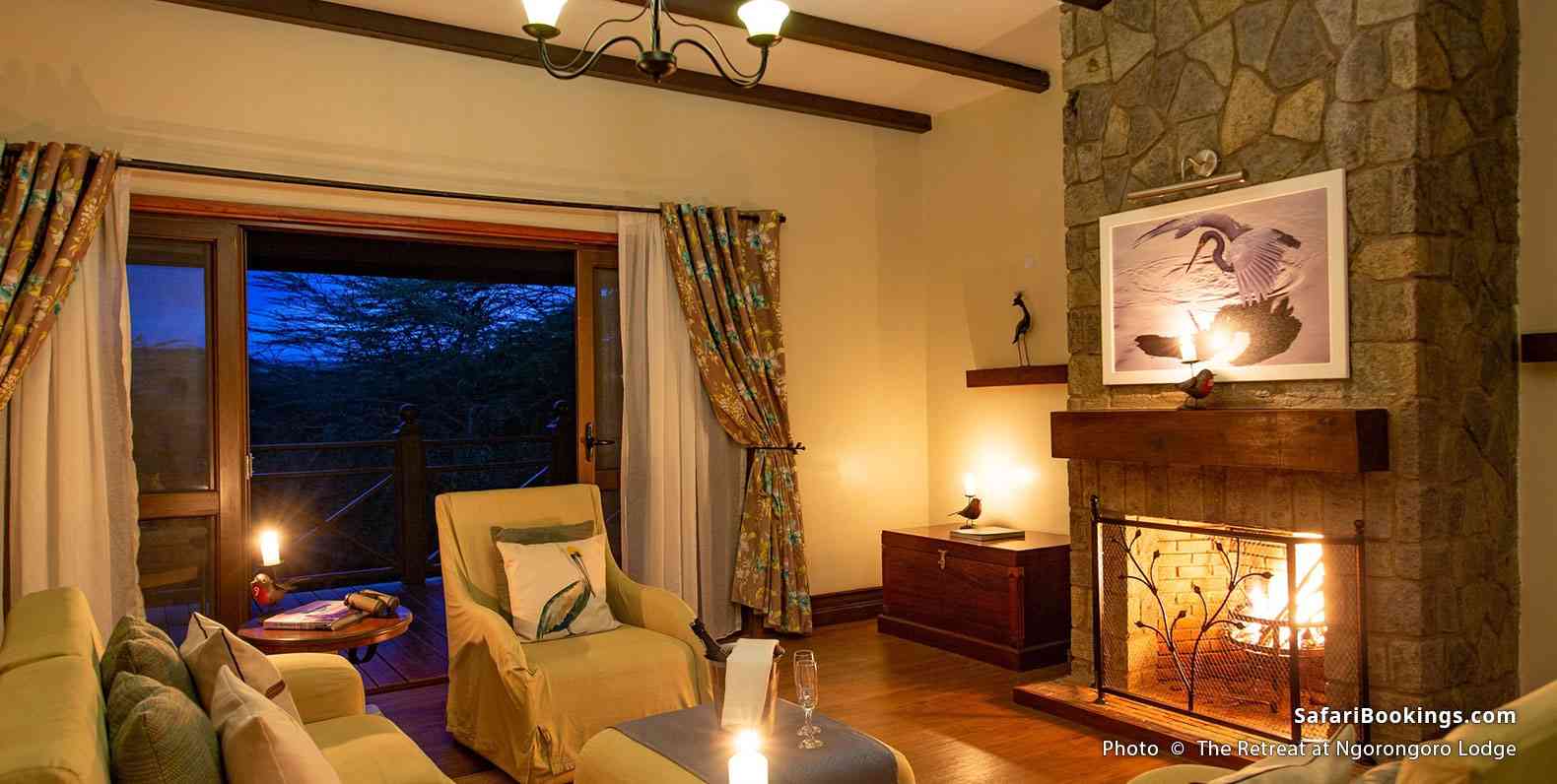Lit up fireplace at The Retreat at Ngorongoro room at dawn