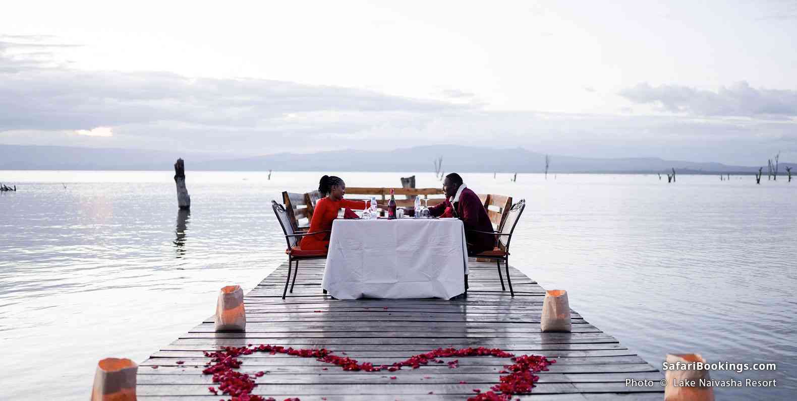 Guests enjoying a romantic dinner on the pier of Lake Naivasha Resort