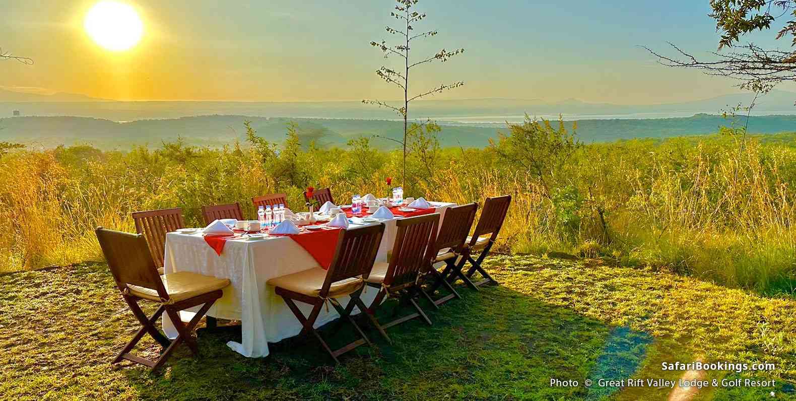 A table served outside on a field at the Great Rift Valley Lodge & Golf Resort