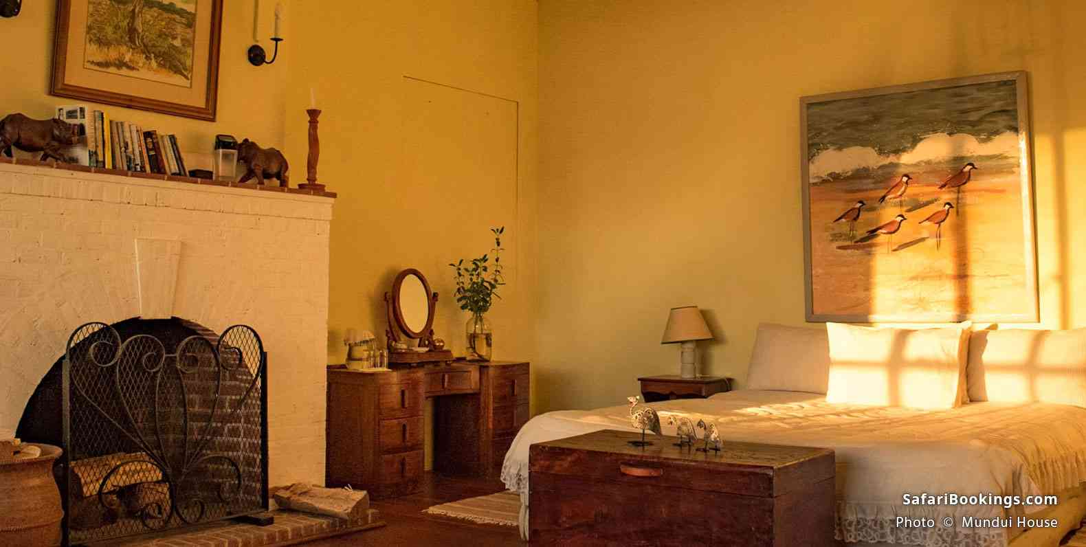 Mundui House suite interior with a fireplace