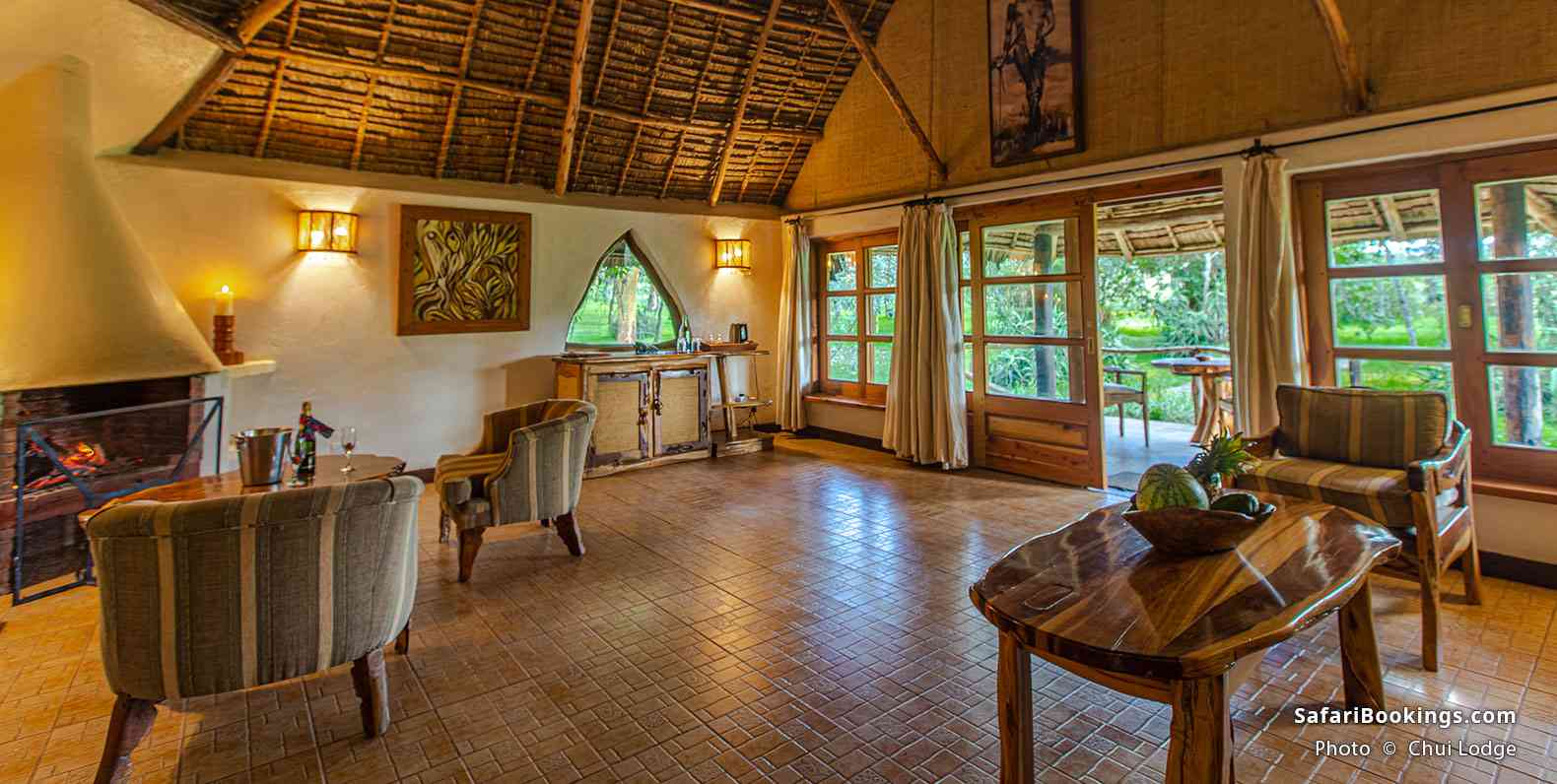 Chui Lodge interior with a fireplace and a terrace
