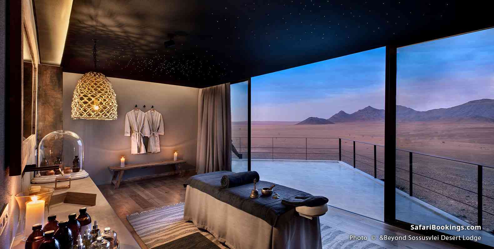 Massage room at &Beyond Sossusvlei Desert Lodge with a desert landscape seen through the window