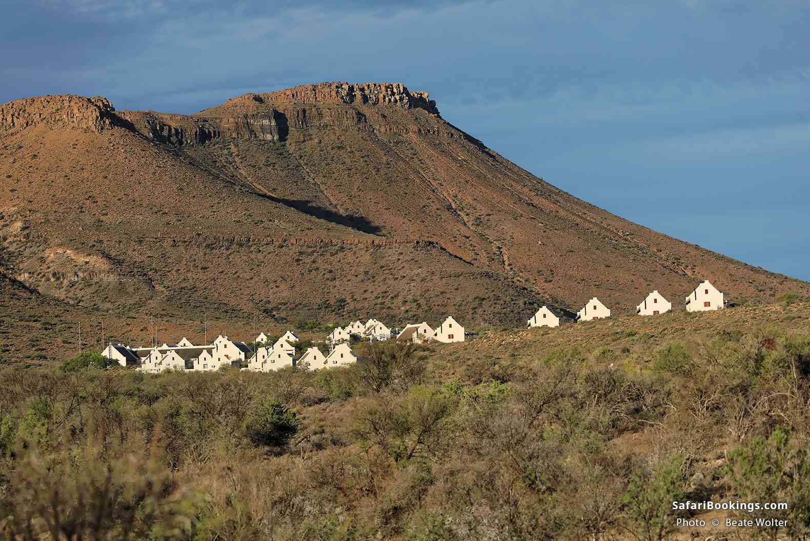 Sunlit cottages set amongst the flat topped mountain, Karoo National park