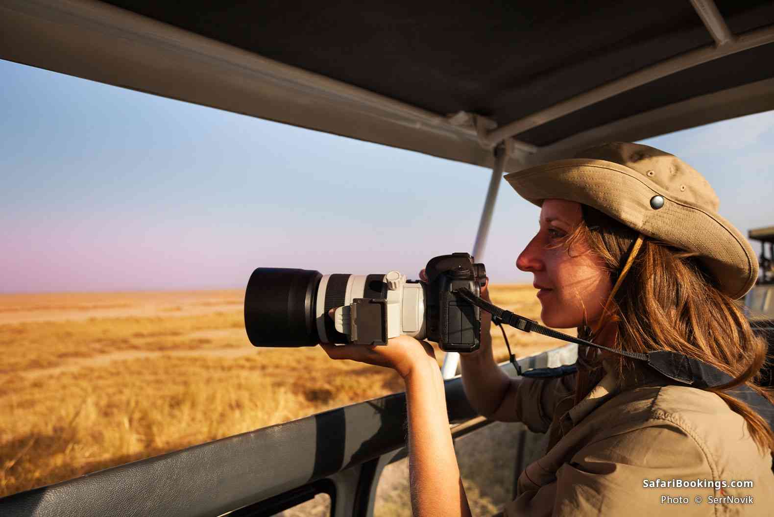 Traveler photographing from a vehicle