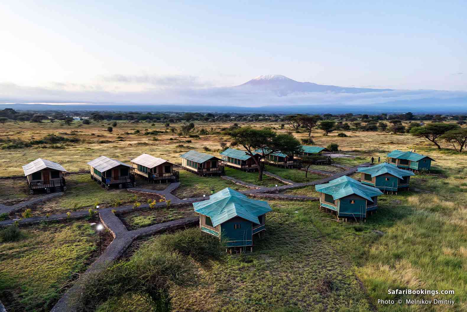 Top view of a tented camp with Mt Kilimanjaro in the background