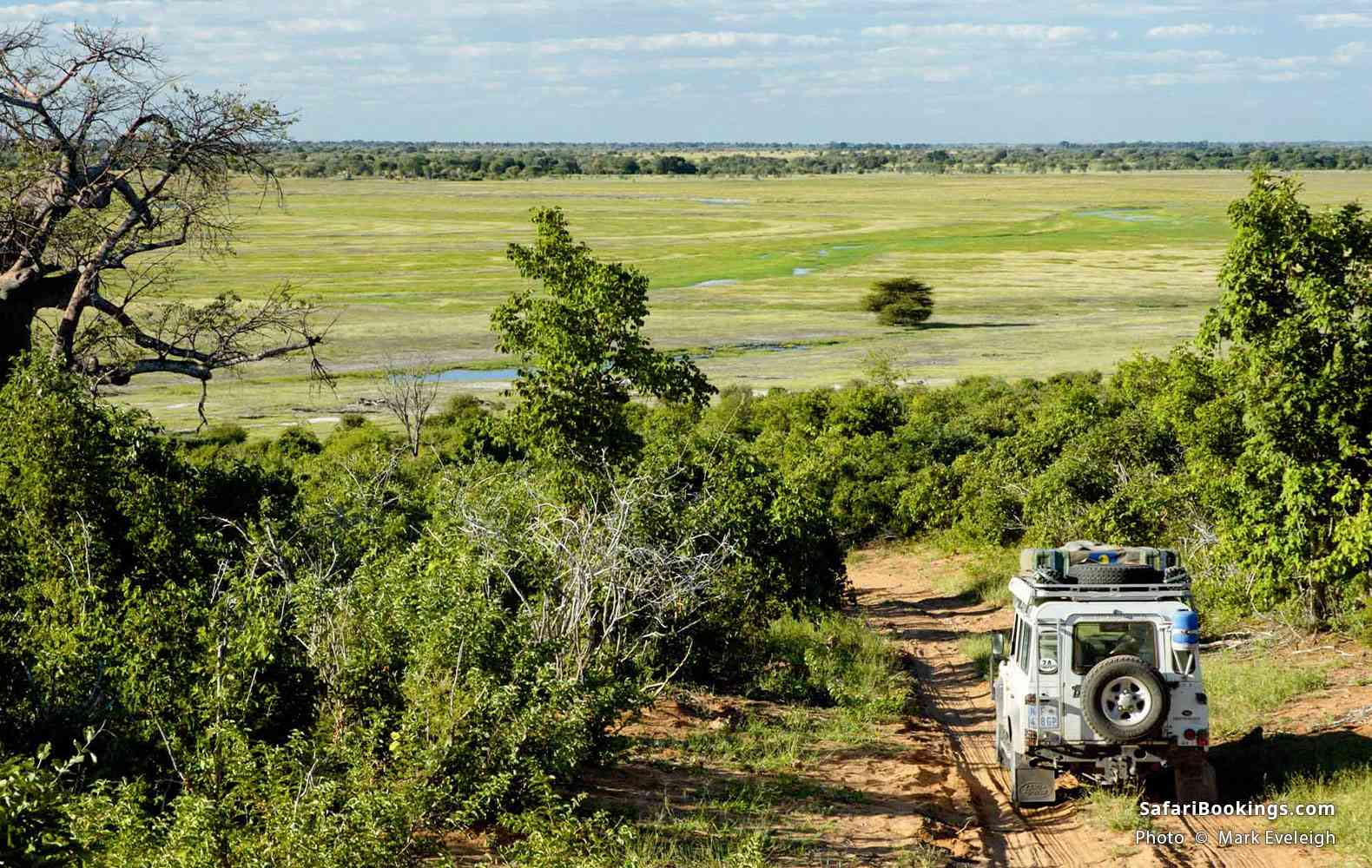 Safari vehicle beside the Chobe floodplains