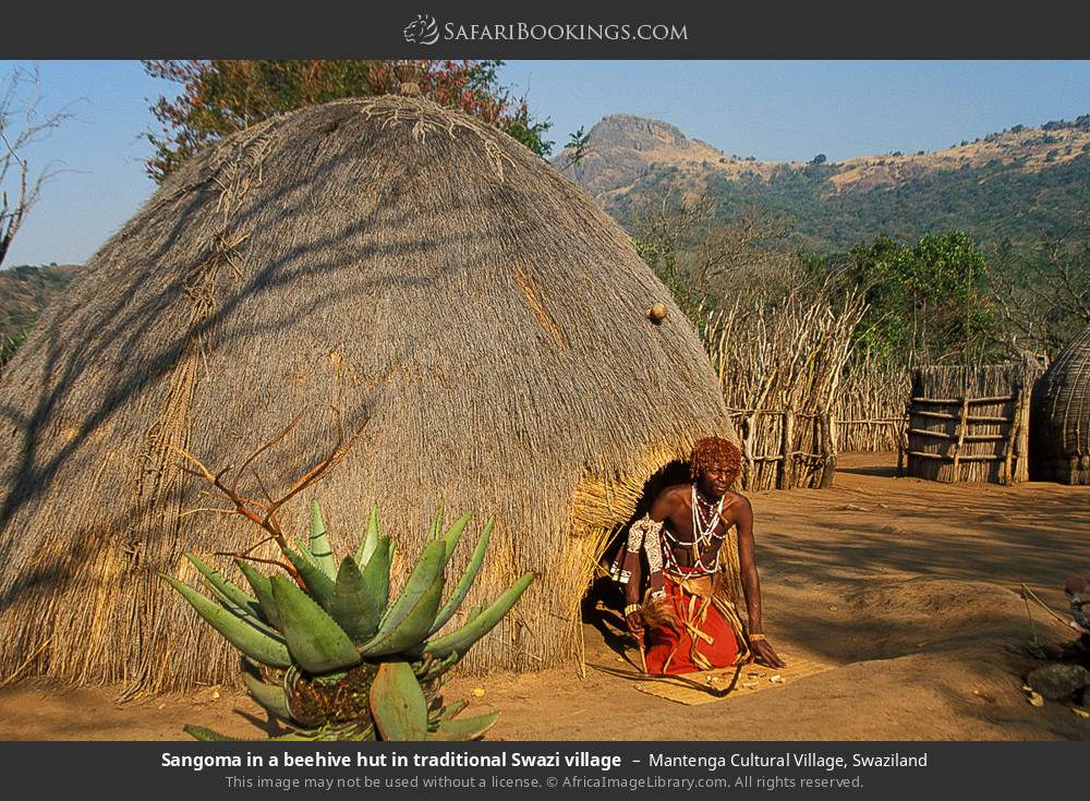 Sangoma in a beehive hut in traditional Swazi village in Mantenga Cultural Village, Eswatini