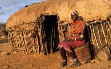 Samburu woman in front of her homestead