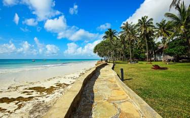 Holiday resort gardens along a sandy beach
