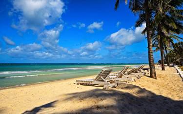 Resort with lounge chairs on the beach
