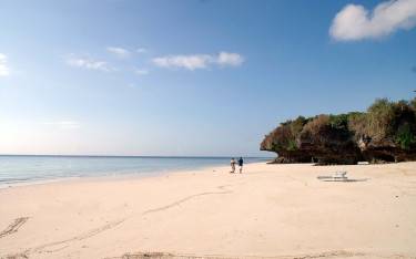 Sandy beach with coral outcrops