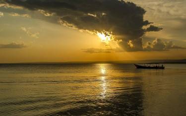 Boat on Lake Victoria at sunset