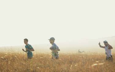 Running through tall grass