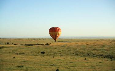 Balloon floating over the open savannah