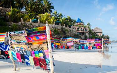 Bright fabrics for sale on the beach