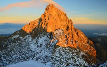 The first rays of sunshine hitting the mountain