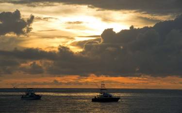 Fishing boats at sunrise