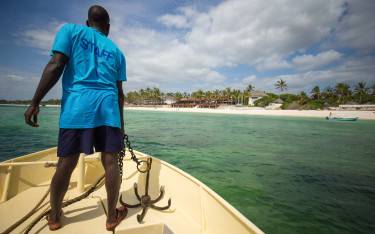 Boat guide preparing to anchor near Watamu
