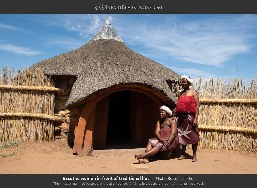 Basotho women in front of traditional hut in Thaba Bosiu, Lesotho