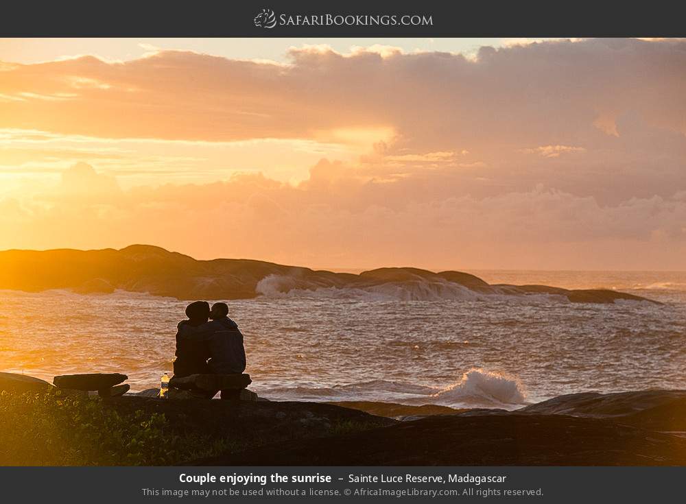 Couple enjoying the sunrise in Sainte Luce Reserve, Madagascar