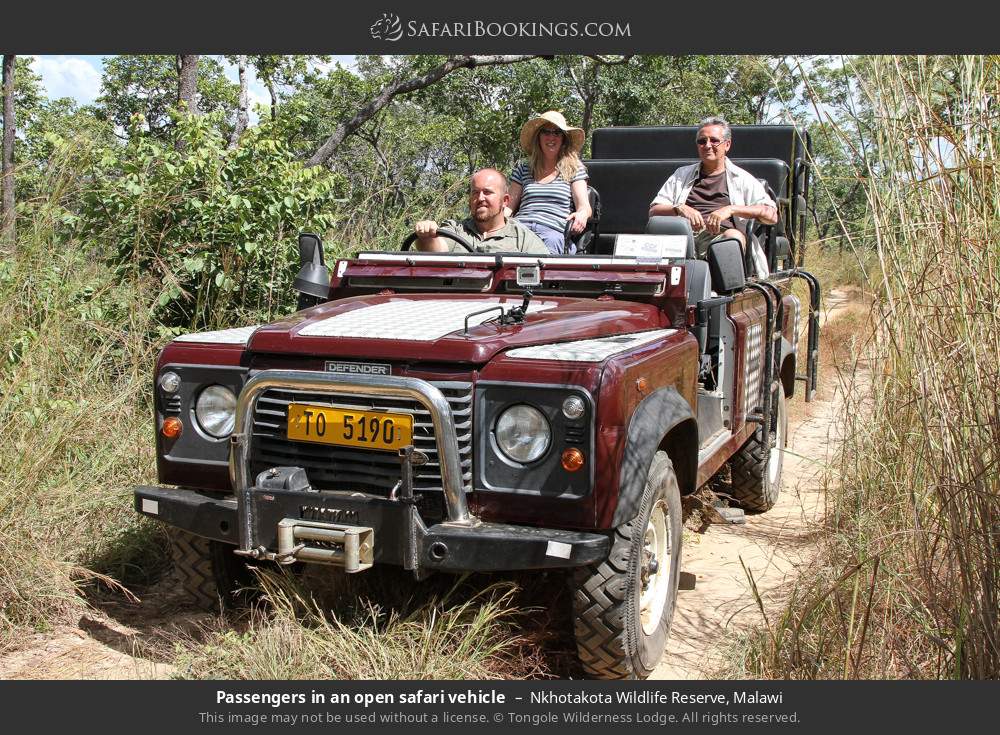 Passengers in an open safari vehicle in Nkhotakota Wildlife Reserve, Malawi