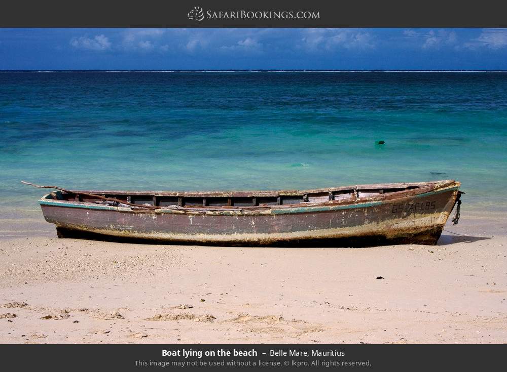 Boat lying on the beach in Belle Mare, Mauritius